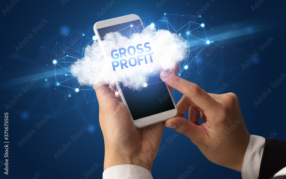 Female hand touching smartphone with GROSS PROFIT inscription, cloud business concept Female hand touching smartphone with GROSS PROFIT inscription, cloud business concept
