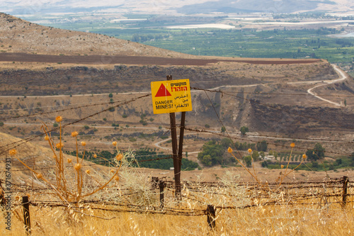 A sign Danger Mines on Golan Heights, Israel photo