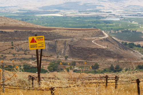 A sign Danger Mines on Golan Heights, Israel photo