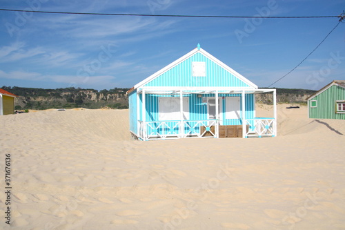 Typical tiny wooden colorful house, in Costa da Caparica, Lisbon, Portugal.