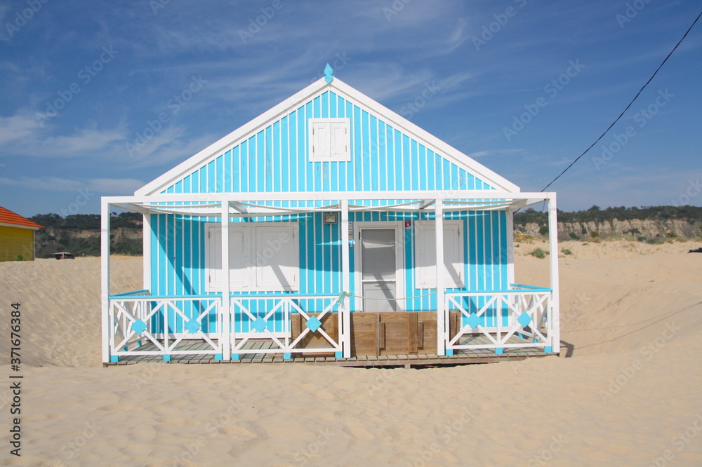 Typical tiny wooden colorful house, in Costa da Caparica, Lisbon, Portugal.