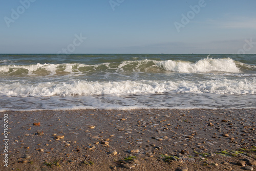 Seashore, waves, sky. Creative vintage background.