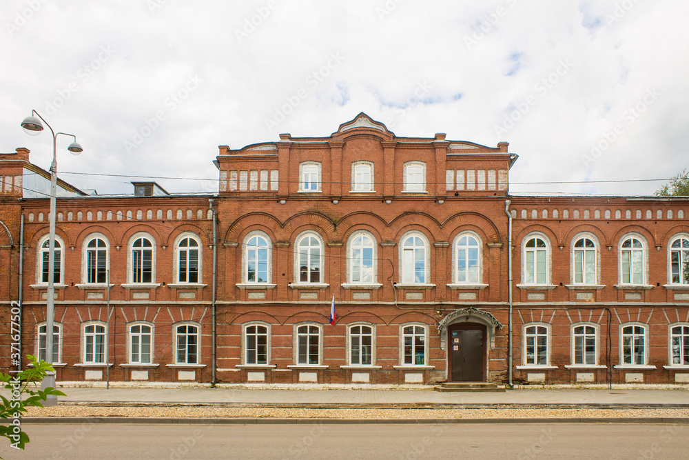old brick building in the historical center of the city on a summer day close-up and copy space in Kalyazin Russia