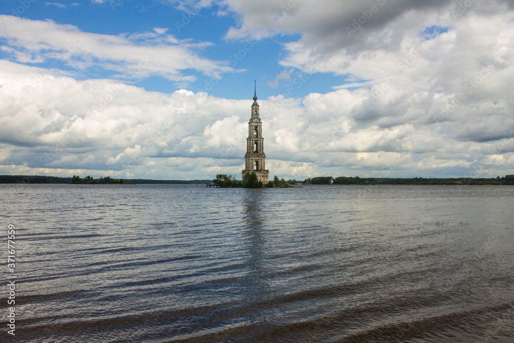 a flooded old bell tower in the middle of a river against a cloudy dramatic sky and a space to copy in Kalyazin Russia a flooded old bell tower in the middle of a river against a cloudy dramatic sky and a space to copy in Kalyazin Russia