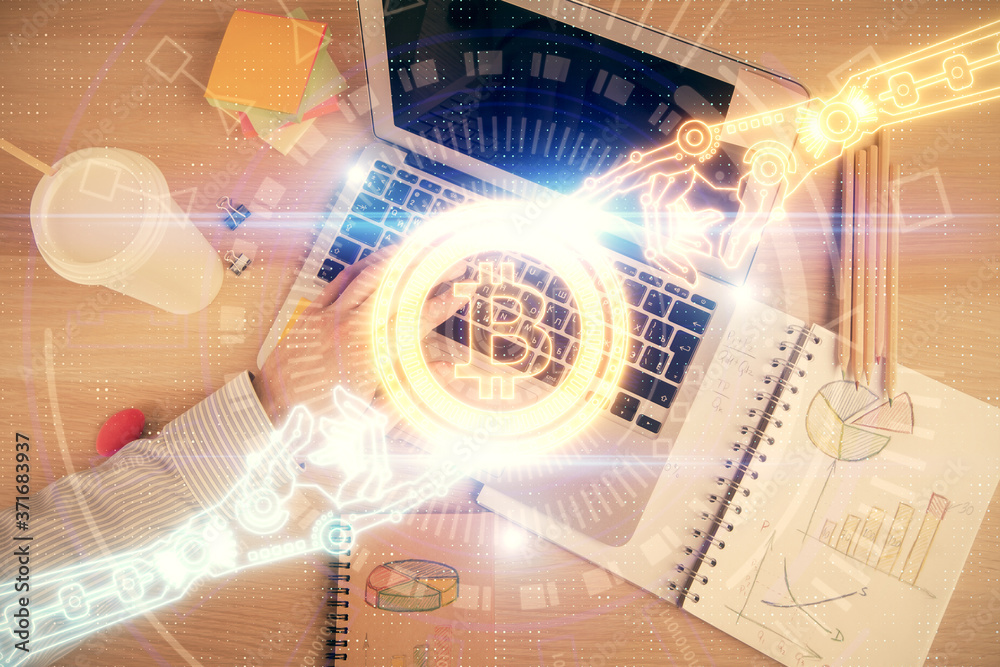 Double exposure of man's hands typing over computer keyboard and crypto currency theme hologram drawing. Top view. Blockchain concept. Double exposure of man's hands typing over computer keyboard and crypto currency theme hologram drawing. Top view. Blockchain concept.