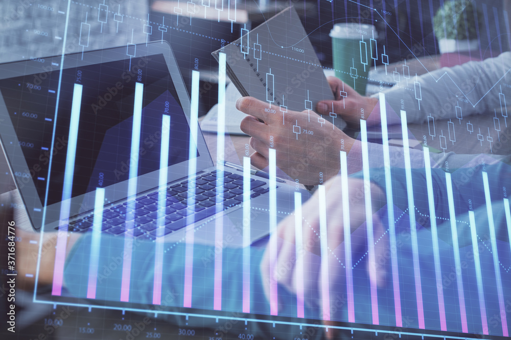Double exposure of man and woman working together and forex chart hologram. Business concept. Computer background. Double exposure of man and woman working together and forex chart hologram. Business concept. Computer background.