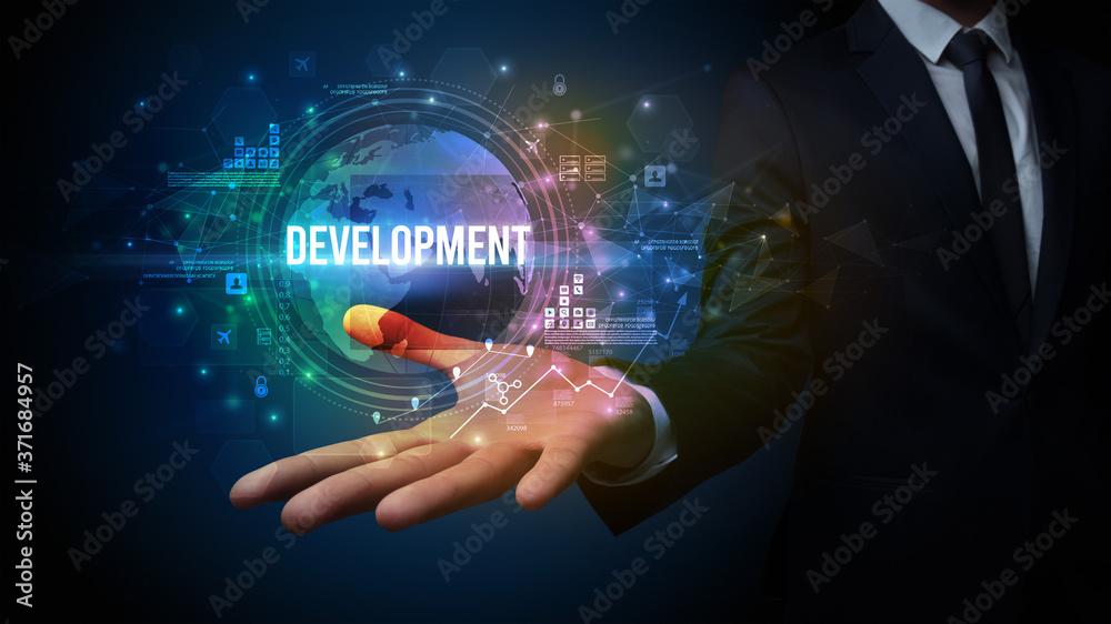 Fototapeta premium Elegant hand holding DEVELOPMENT inscription, digital technology concept
