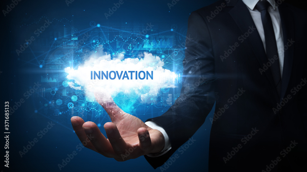 Hand of Businessman holding INNOVATION inscription, successful business concept Hand of Businessman holding INNOVATION inscription, successful business concept