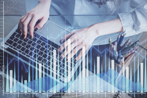 Double exposure of woman hands typing on computer and forex chart hologram drawing. Stock market invest concept.