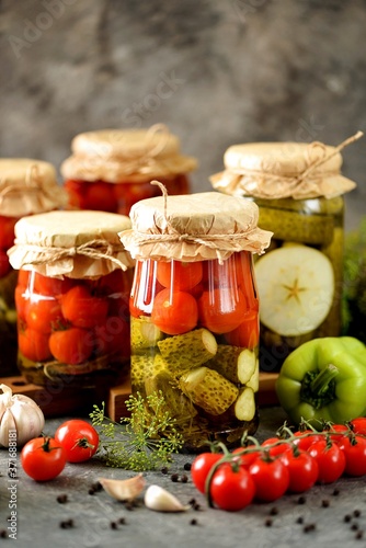 Homemade assorted vegetables - pickled cucumbers and cherry tomatoes.