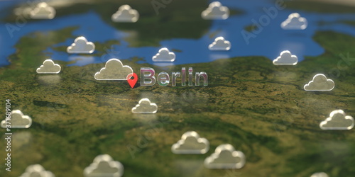 Cloudy weather icons near Berlin city on the map, weather forecast related 3D rendering