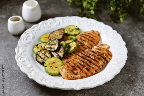 Grilled chicken breast, courgettes and eggplants marinated with olive oil, garlic and soy sauce. Healthly food.