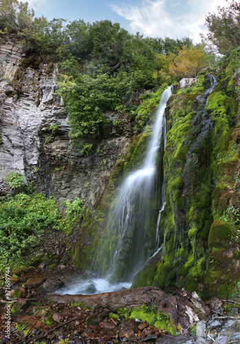 Fototapeta Naklejka Na Ścianę i Meble -  A waterfall no one has visited but me cascades down the side of mount timpanogos in Utah.