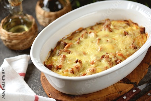 Potato casserole with fried chanterelles, onions and cheese.
