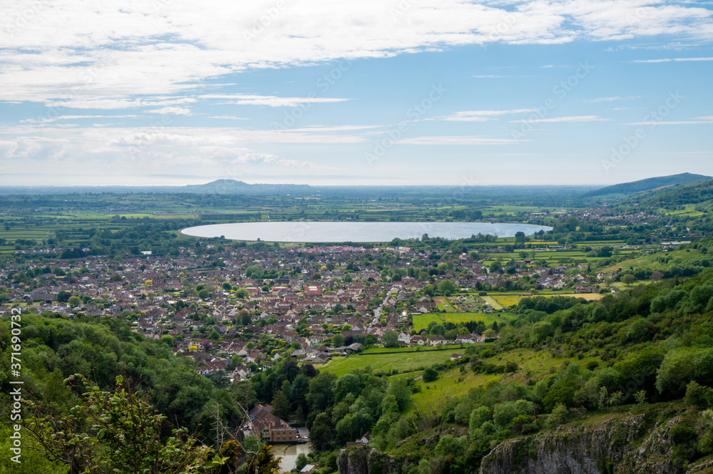 Wide angle view of the village of Cheddar with reservoir near Cheddar George, Somerset, UK