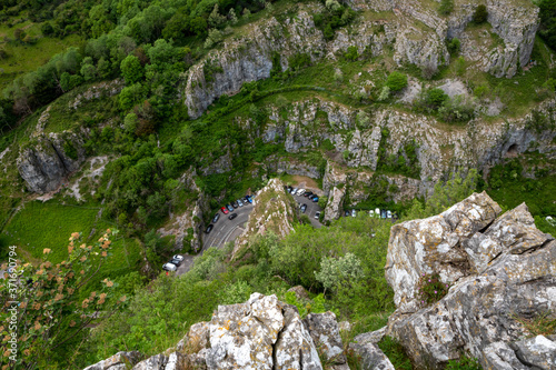 Cliffs of Cheddar Gorge from high viewpoint. High limestone cliffs in canyon in Mendip Hills in Somerset, England, UK photo