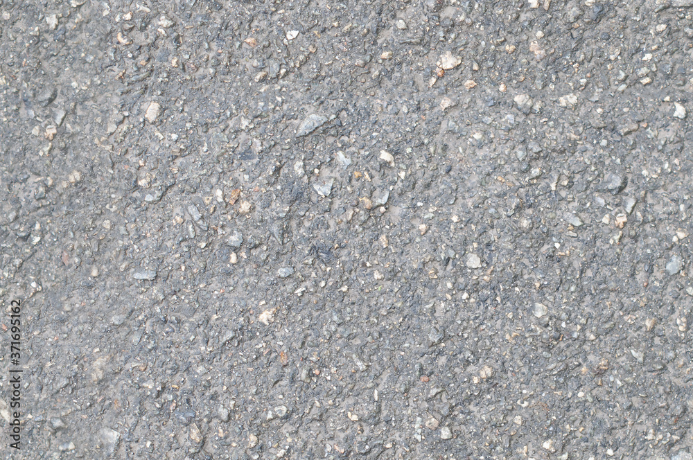 The seamless texture of the asphalt close-up The seamless texture of the asphalt close-up