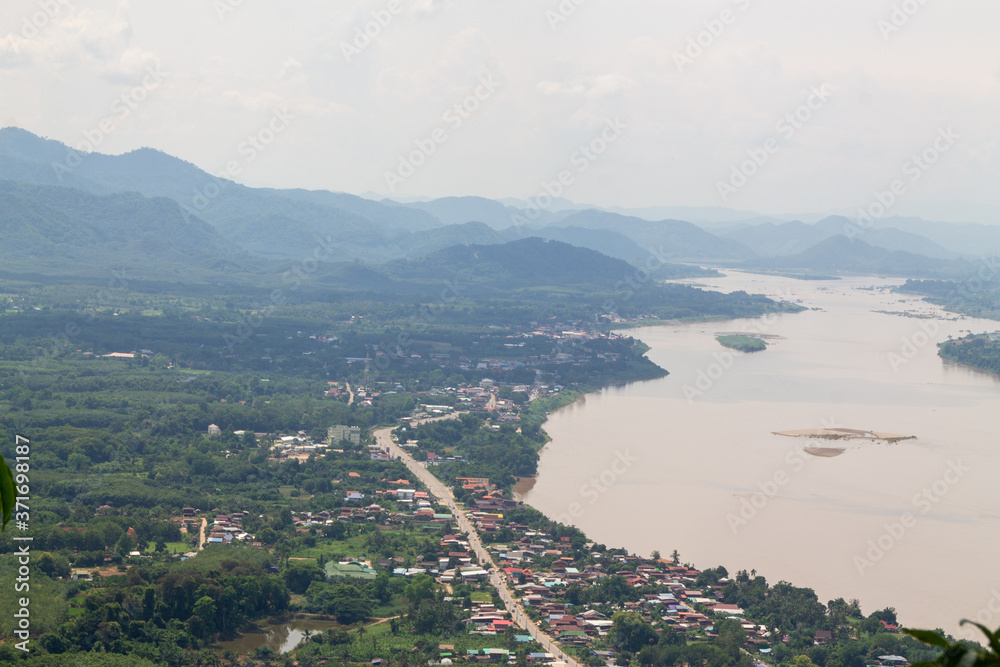 Laos area seen from above There is a Mekong River divided between Thailand and Laos. Saw a small village along the Mekong River