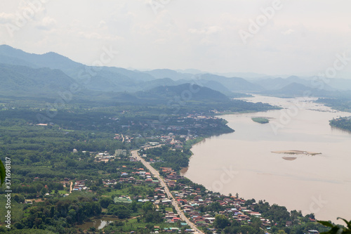Laos area seen from above There is a Mekong River divided between Thailand and Laos. Saw a small village along the Mekong River