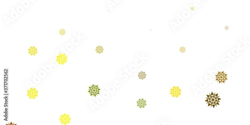 Light green, yellow vector pattern with colored snowflakes.