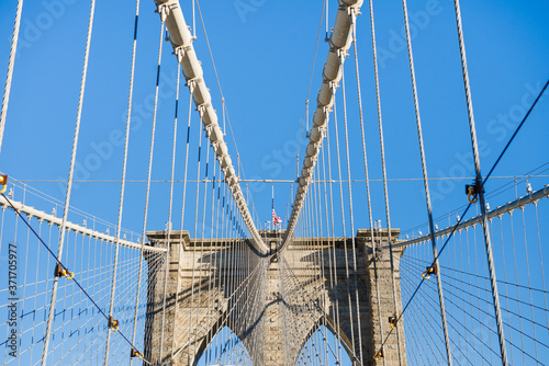 Detail of Brooklyn Bridge column with blue sky
