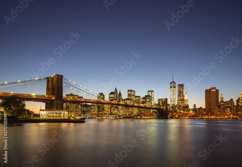 Brooklyn Bridge and Manhattan skyline in New York, USA at night © Mark