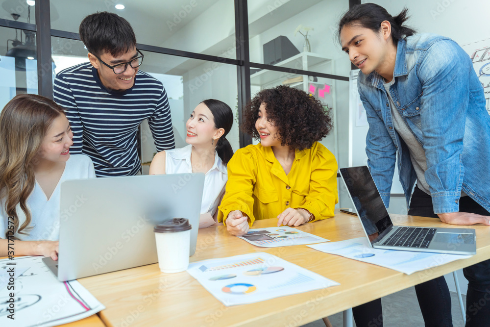 Group of asian young creative happy people entrepreneur on a business meeting office background Good leadership and teamwork lead to success Group of asian young creative happy people entrepreneur on a business meeting office background Good leadership and teamwork lead to success