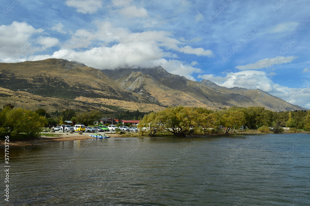 Garden Queenstown With house and car park and mountain background