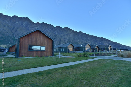 Garden Queenstown With house and car park and mountain background