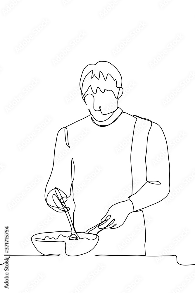 male chef stands over a deep frying pan, in which a large spoon is stirring the dish being prepared, with his other hand he holds the handle