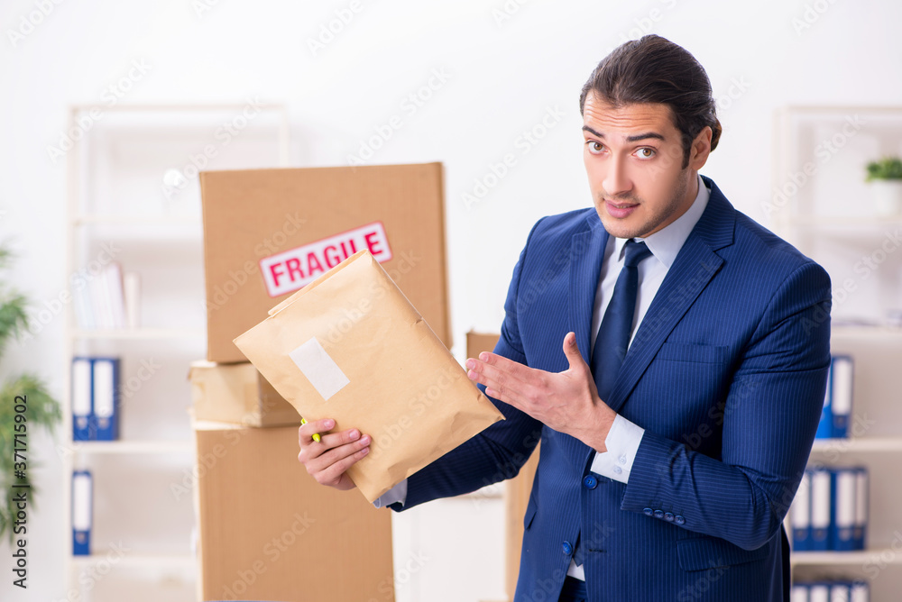 Young male logistics specialist working in the office Young male logistics specialist working in the office