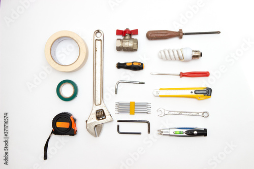 decorating and house renovation tools and other essentials on white background top view. flat lay