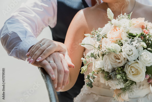 bride and groom holding hands