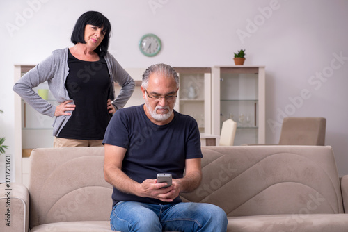 Old couple having argument at home