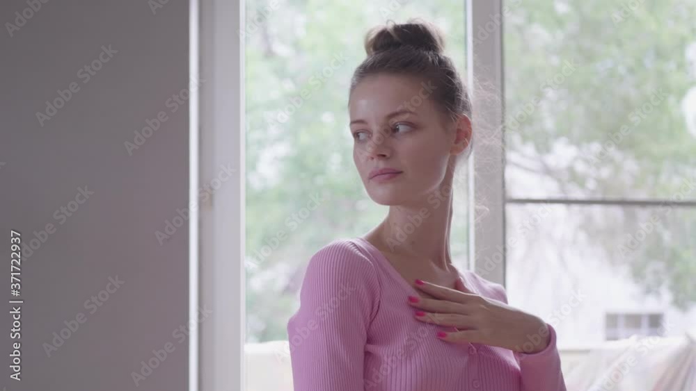 slender woman in pink sweater, black ballet skirt and pointe shoes doing exercises at home, adapting existing furniture for this slender woman in pink sweater, black ballet skirt and pointe shoes doing exercises at home, adapting existing furniture for this
