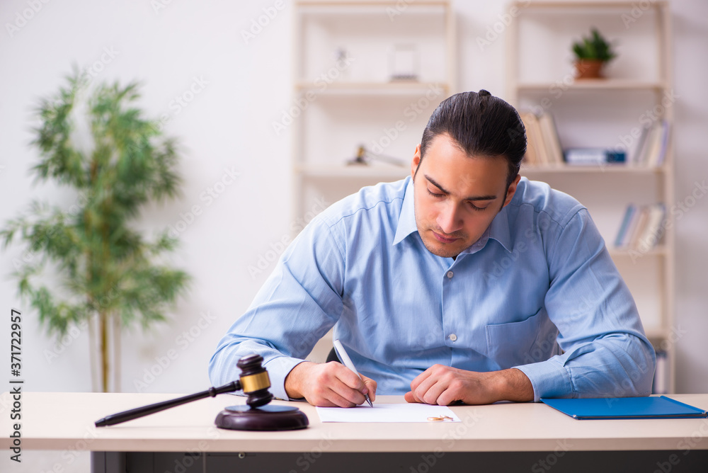 Young man in courthouse in divorcing concept Young man in courthouse in divorcing concept