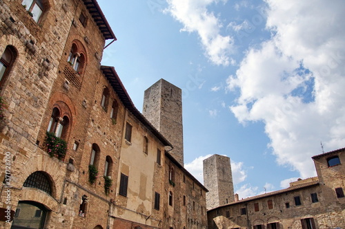 Panoramic view of famous Piazza della Cisterna in the historic town of San Gimignano on a morning, Tuscany, Italy.