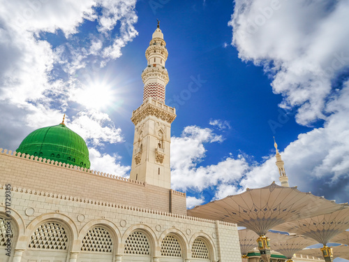 Fototapeta Madinah, Saudi Arabia - July 07, 2020: View of cloudy blue sky at Nabawi Mosque or Prophet Mosque in Madinah, Saudi Arabia