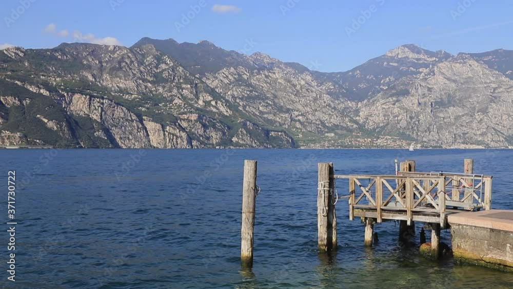 The view across Lake Garda from Malcesine. Malcesine is a resort town on the edge of Lake Garda in North East Italy. The view across Lake Garda from Malcesine. Malcesine is a resort town on the edge of Lake Garda in North East Italy.