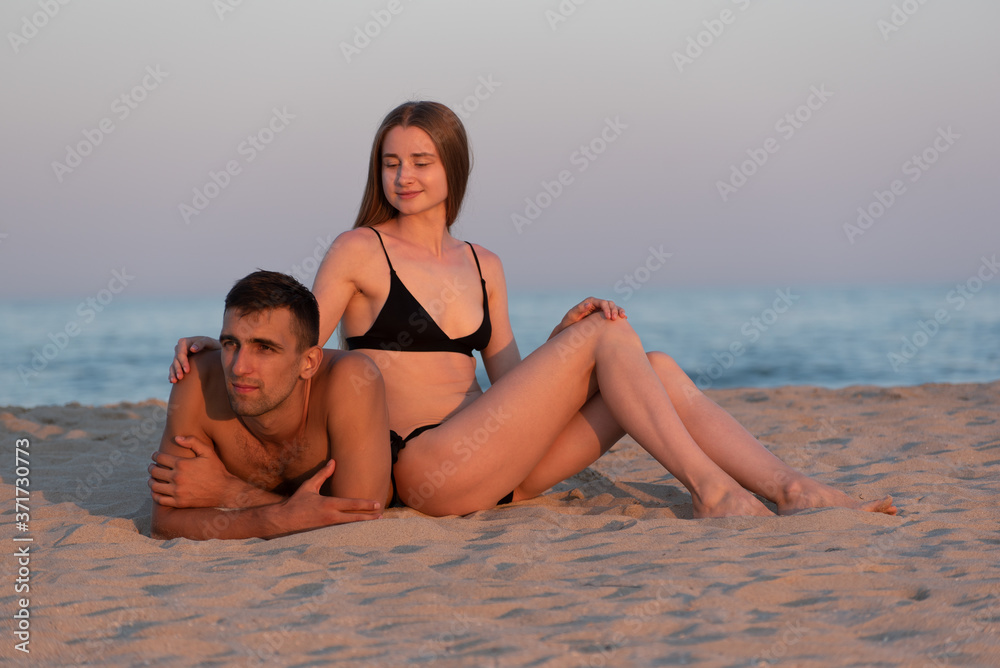 A young couple of lovers on the seashore
