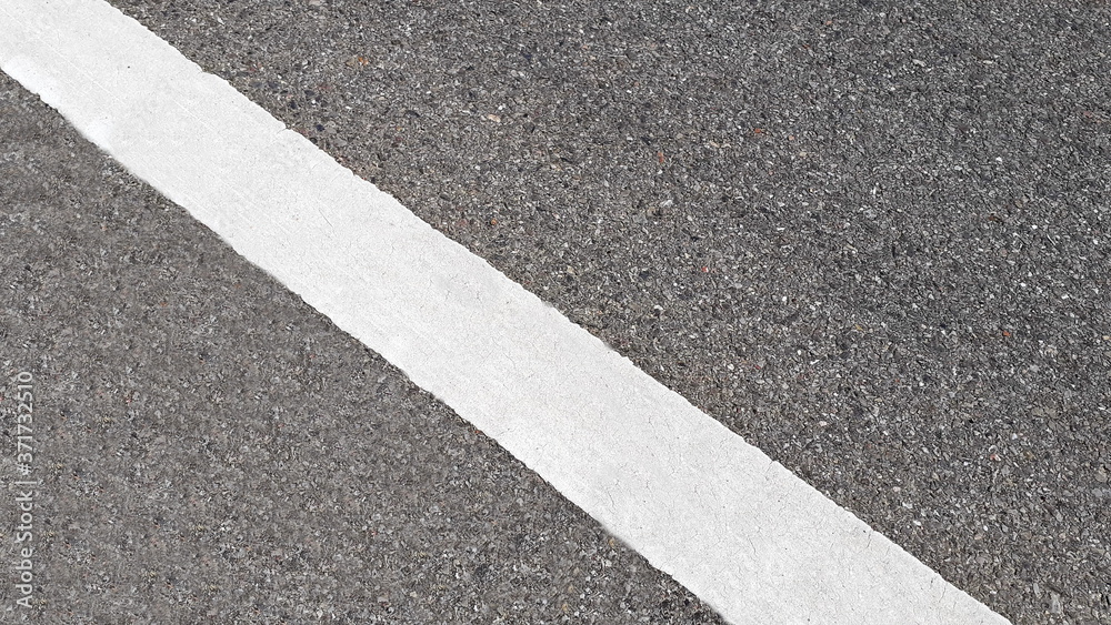 White paint line on asphalt road surface, with gray color guidelines on street, close up texture background concept, countryside Thailand. White paint line on asphalt road surface, with gray color guidelines on street, close up texture background concept, countryside Thailand.
