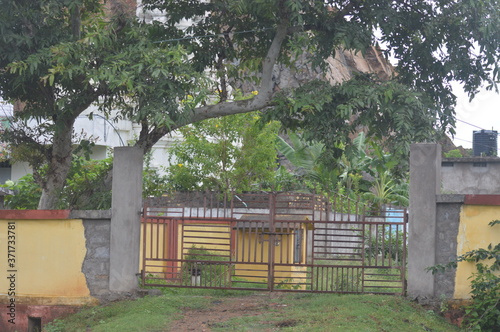 Gate and old house in the village