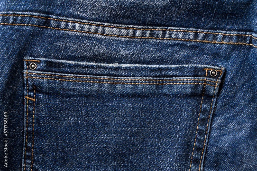 Denim pants pocket. Back pocket of blue jeans. Denim pants pocket. Back pocket of blue jeans.