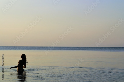  girl at sea at sunrise © andros1983