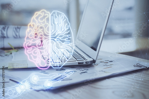 Multi exposure of work space with computer and human brain hologram. Brainstorm concept.