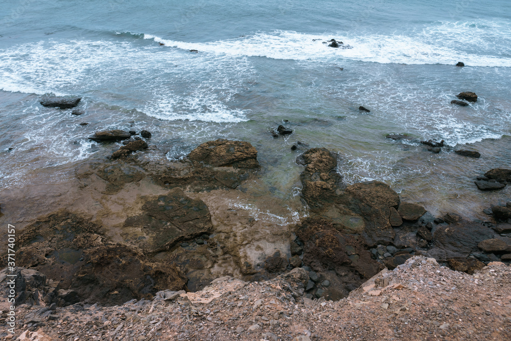 Rocky Atlantic coastline at low tide. Fuerteventura. Canary Islands. Spain.