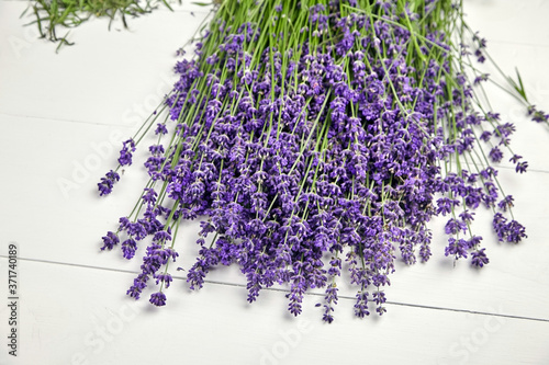 Lavender flowers bunch on white wooden background