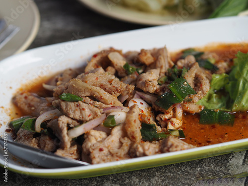 Slide grilled pork salad on plate, Thai food
