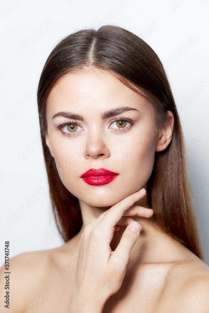Brunette skin care Keeps a hand near the face with clean skin light Brunette skin care Keeps a hand near the face with clean skin light