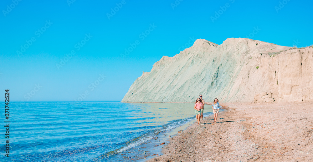 Happy beautiful family on a tropical beach vacation Happy beautiful family on a tropical beach vacation